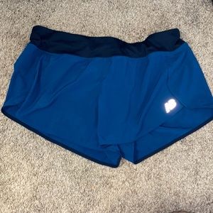 Blue New Balance running shorts